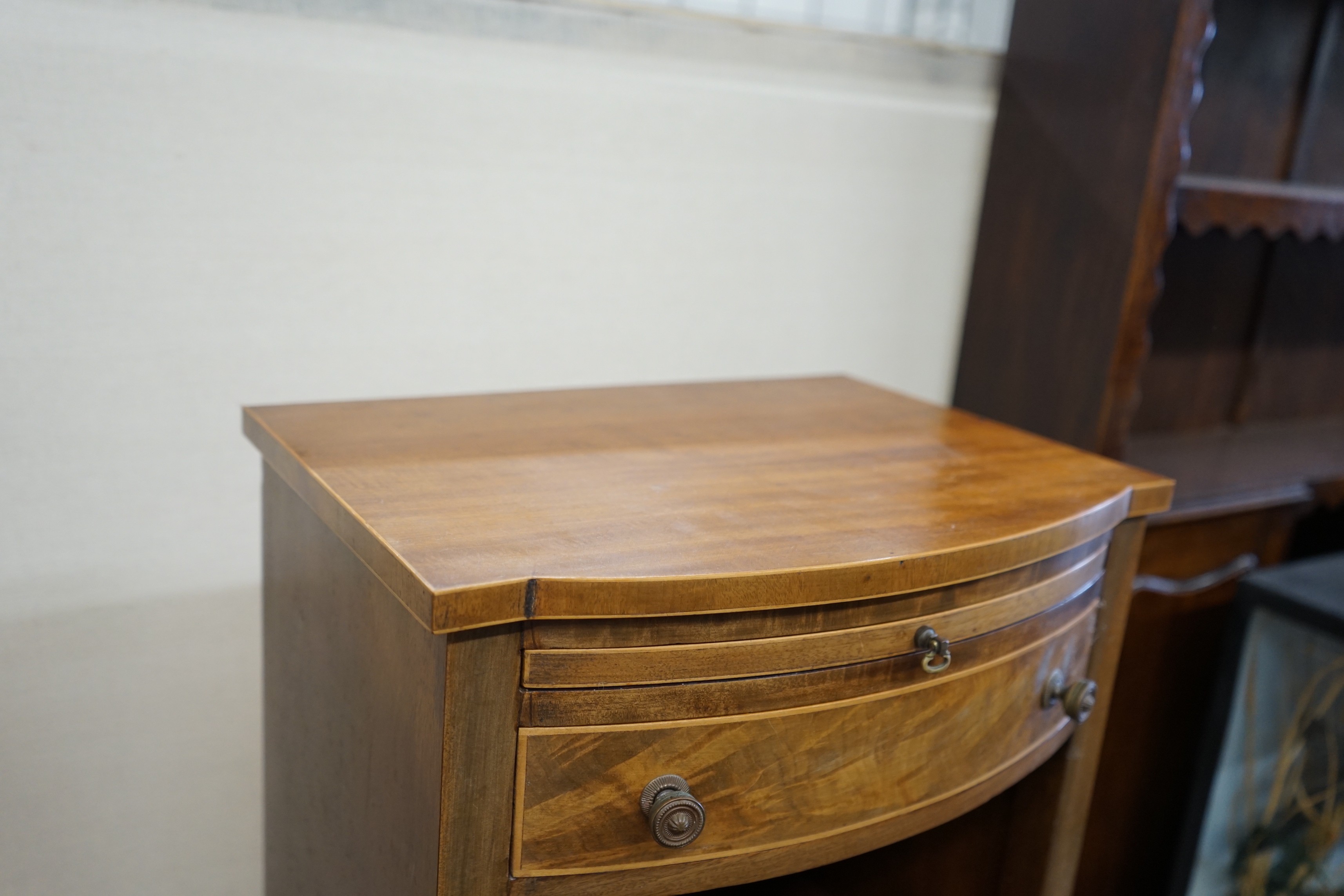 A pair of George III style mahogany bowfront bedside cabinets, width 40cm, depth 30cm, height 76cm